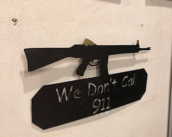 AK We don't call 911 metal sign with AK rifle