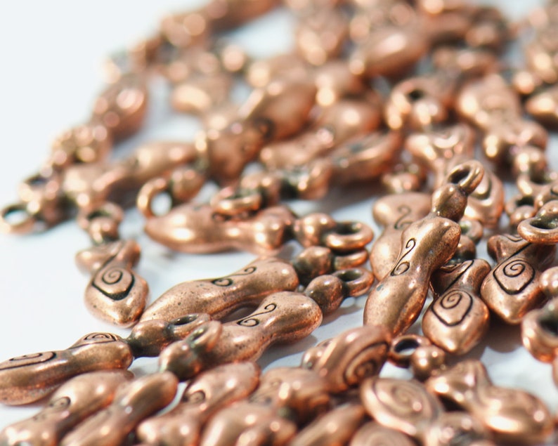 bulk jewelry charms in antique copper featuring strong woman in boho style for necklaces and bracelets