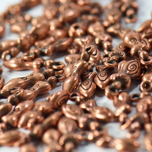 bulk jewelry charms in antique copper featuring strong woman in boho style for necklaces and bracelets