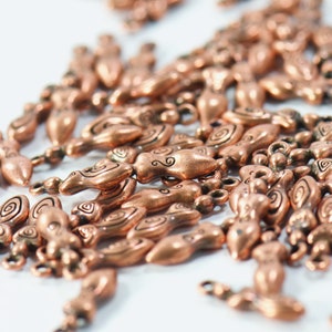bulk jewelry charms in antique copper featuring strong woman in boho style for necklaces and bracelets