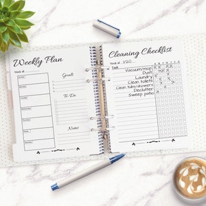May include: A white and black weekly planner and cleaning checklist. The planner has sections for goals, to-do lists, and notes. The checklist has a column for each day of the week and a list of cleaning tasks.