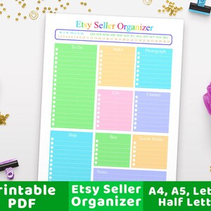 K&ouml;nnte beinhalten: Druckbarer Etsy-Verk&auml;ufer-Organizer mit Abschnitten f&uuml;r To Do, Herstellen, Fotografieren, Listen, Kontakt, Versand, Kaufen, Social Media und Notizen. Der Organizer enth&auml;lt einen Kalender f&uuml;r das Jahr mit in Regenbogenfarben beschrifteten Monaten.