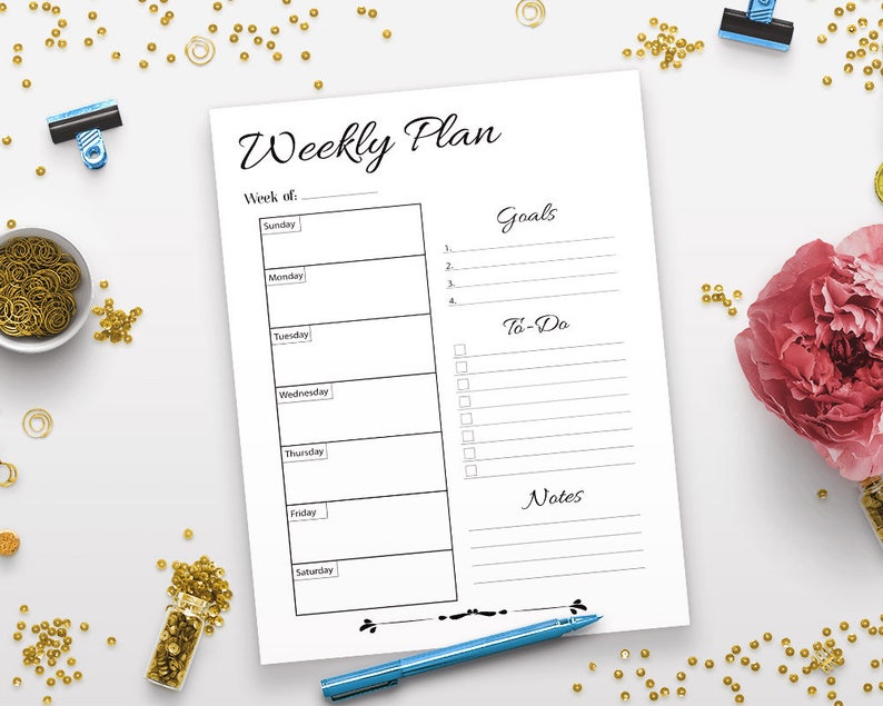 May include: A printable weekly planner with sections for goals, to-do list, and notes. The planner has a simple black and white design with a handwritten font.