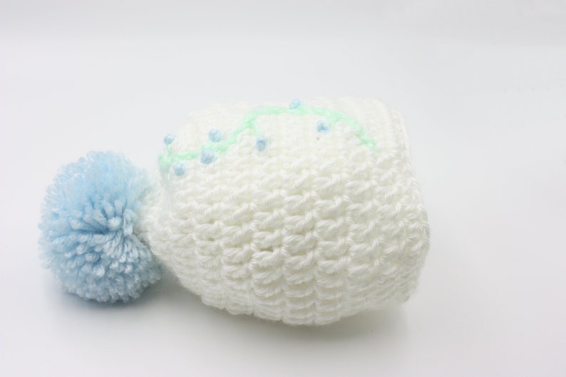 White Baby Hat With Blue Floral Embroidery and Blue Pompom Newborn Hat
