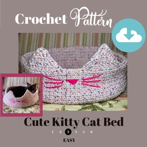 May include: Crochet pattern for a cute kitty cat bed. The bed is white with pink accents and a cat face design. The pattern is rated easy and includes a download icon.