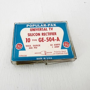 May include: A vintage Popular-Pak Universal TV Silicon Rectifier, type GE-504-A, in a clear plastic case. The blue and white label includes the GE logo, technical specifications, and "Made in U.S.A." text. The label also includes the text "60 AMPS 1 AMP".