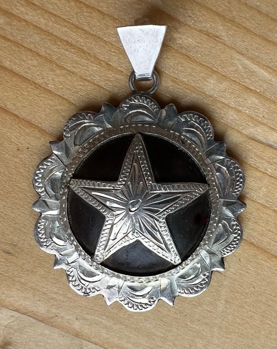 Really Cool Tooled Sterling Star set on a Iron Bac