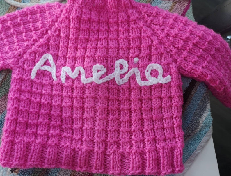 Ainm, Hand-knitted baby cardigan, personalised with your baby's name by me, Irish baby knitwear, embroidered baby cardigan. image 1