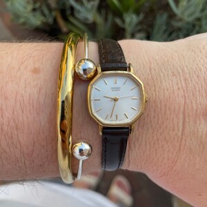 TOCCA NOBLE WATCH ジュエリーウォッチ ゴールド/ダイヤ NIXON SK-09 ( The Score ) Gold Watch 90's . ( Game of