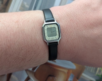 Vintage TIMEX Silver Tone Digital Quartz Watch with New Black Leather Band and New Battery.  Best fits 6.5” wrist or smaller.