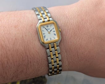 Vintage SEIKO Two Quartz Tank Watch Blue Roman Numeral Detail and New Battery. Best fits 6.5” wrist or smaller.