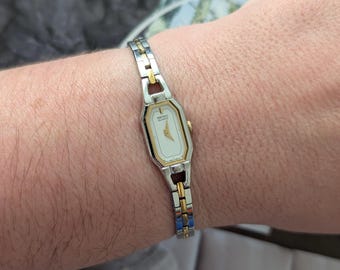 Vintage SEIKO Two Tone Tank Quartz Watch with Hexagon Bezel and New Battery. Best fits 6.5” wrist or smaller.