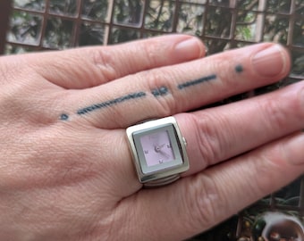 Vintage TIMEX Silver Tone Quartz Ring Watch with Purple Dial and New Battery.  Stretch Band Fits Multiple Sizes.