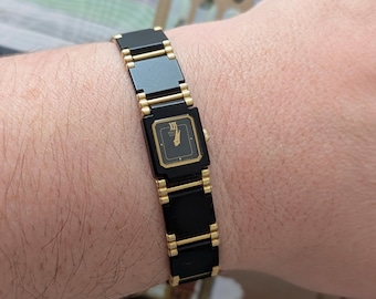 Vintage SEIKO Black and Gold Small Face Quartz Watch with New Battery. Best fits 7” wrist or smaller.