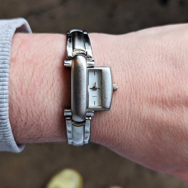 Vintage Waltham Silver Quartz Hidden Face Slide Watch with New Battery. Best fits 8” wrist or smaller.