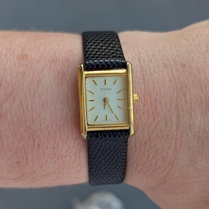 Vintage PULSAR Gold Tone Tank Quartz Watch with New Black Leather Band and New Battery.  Best fits 7” wrist or smaller.