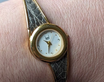 Vintage HEEL Gold Tone Cuff Quartz Watch From Japan With
