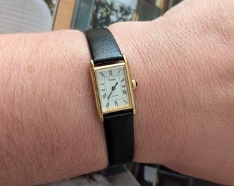 Vintage PULSAR Gold Tone Mini Tank Quartz Watch with New Black Leather Band and New Battery.  Best fits 6.5” wrist or smaller.