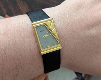 Vintage SEIKO Starburst Asymmetrical Piano Style Quartz Watch New Black Leather Band New Battery. Best fits 7.5” wrist or smaller.
