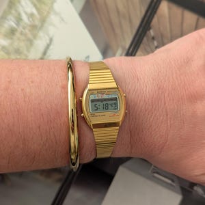 Vintage ARMITRON Gold Tone Digital Quartz Watch with New Battery. Best fits 8” wrist or smaller.