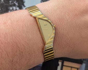 Vintage Seiko Half Moon Watch from Gold Tone Quartz Watch with new battery. Fits 6.5” wrist or smaller.