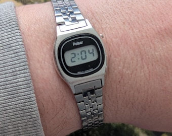 Vintage PULSAR Silver Tone Digital Quartz Watch with New Battery.  Best fits 6” wrist or smaller.