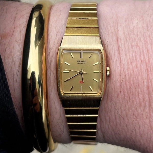 Vintage SEIKO Gold Quartz Tank Style Watch with New Battery. Best fits 6.75” wrist or smaller.