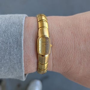 Vintage SEIKO Gold Tone Quartz Watch with Gold Face and New Battery.  Best fits 7.5” wrist or smaller.