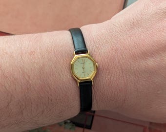 Vintage Pulsar by SEIKO Gold Tone Quartz  Watch with Octagon Bezel, New Black Leather Band and New Battery. Fits 6.5” wrist or smaller.