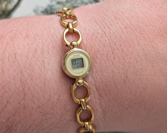 Vintage ALBA Gold Tone Quartz Digital Watch with Yellow and Gold Face and New Battery.  Best fits 7” wrist or smaller.