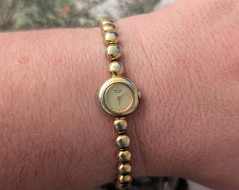 Vintage SEIKO Gold Tone Quartz Watch With Ball Link Band and New Battery. Best Fits 7” wrist or smaller.
