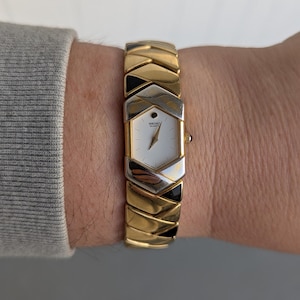 Vintage SEIKO Gold Tone Quartz Watch with Black Detail and New Battery.  Best fits 6” wrist or smaller.