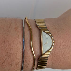 Vintage SEIKO Half Moon Watch from Gold Tone Quartz Watch with new battery. Fits 6.5” wrist or smaller.