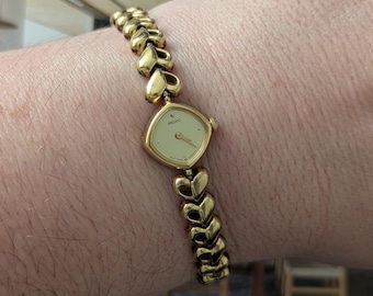 Vintage SEIKO Gold Tone Tank Quartz Watch with Heart Band and New Battery. Best fits 7” wrist or smaller.
