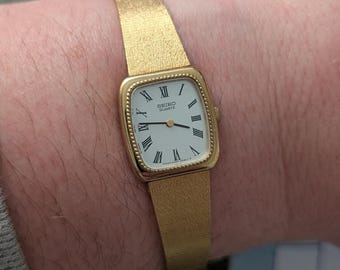 Vintage SEIKO Gold Tone Tank Quartz Watch with New Battery.  Best fits 6.5” wrist or smaller.