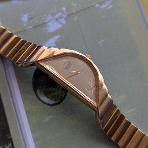 Vintage SEIKO Half Moon Watch from Gold Tone Quartz Watch with new battery. Fits 5.75” wrist or smaller.