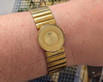 Vintage Seiko Gold Tone Quartz Watch with Gold Dial and New Battery.  Best fits 6.5” wrist or smaller.