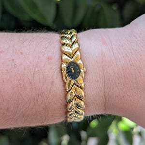 Vintage SEIKO Gold Tone Quartz Watch with new battery. Best fits 7” wrist or smaller.
