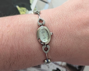 Vintage ANNE KLEIN Silver Tone Quartz Watch with Heart Shape Crystal Band and New Battery.  Best fits 7” wrist or smaller.