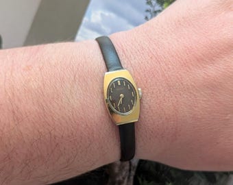 Vintage SEIKO Gold Tone Winding Watch with Brown Dial, New Brown Leather Band and New Battery. Fits 6.5” wrist or smaller.