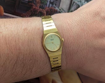 Vintage GUCCI Gold Tone Quartz Watch With Black Face 