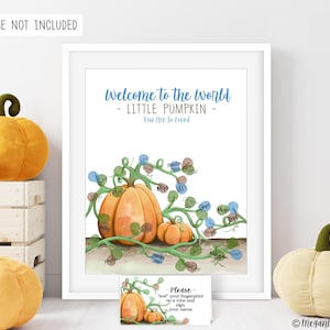 May include: A white framed print with the text "Welcome to the world - LITTLE PUMPKIN - You Are So Loved". The print features a watercolor illustration of pumpkins and vines, designed for fingerprints. A small card reads "Please - 'leaf' your fingerprint on a vine and sign your name."