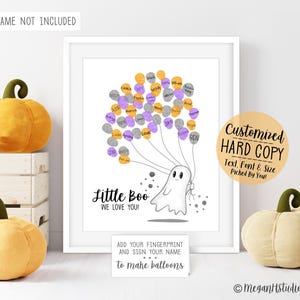 May include: A white print featuring a cartoon ghost holding a cluster of balloons made from fingerprints in orange, purple, and gray. The text reads Little Boo WE LOVE YOU! and includes a sign that says ADD YOUR FINGERPRINT AND SIGN YOUR NAME.