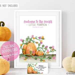 May include: A white rectangular print featuring a watercolor illustration of two orange pumpkins with green vines. The text reads Welcome to the World - LITTLE PUMPKIN - You Are So Loved. The vines include colorful fingerprint spots with names.
