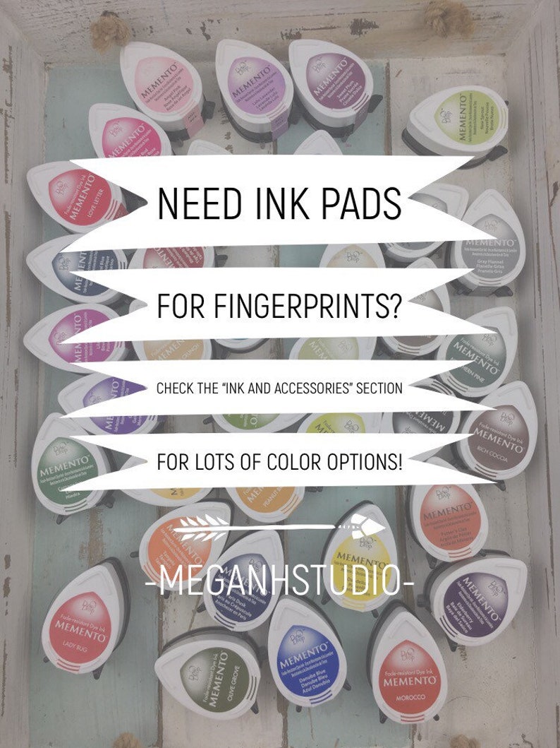 May include: A collection of Memento ink pads in various colors, including red, purple, and green, arranged on a light blue wooden surface. Text on the image reads "Need Ink Pads for Fingerprints?" and "For Lots of Color Options!"