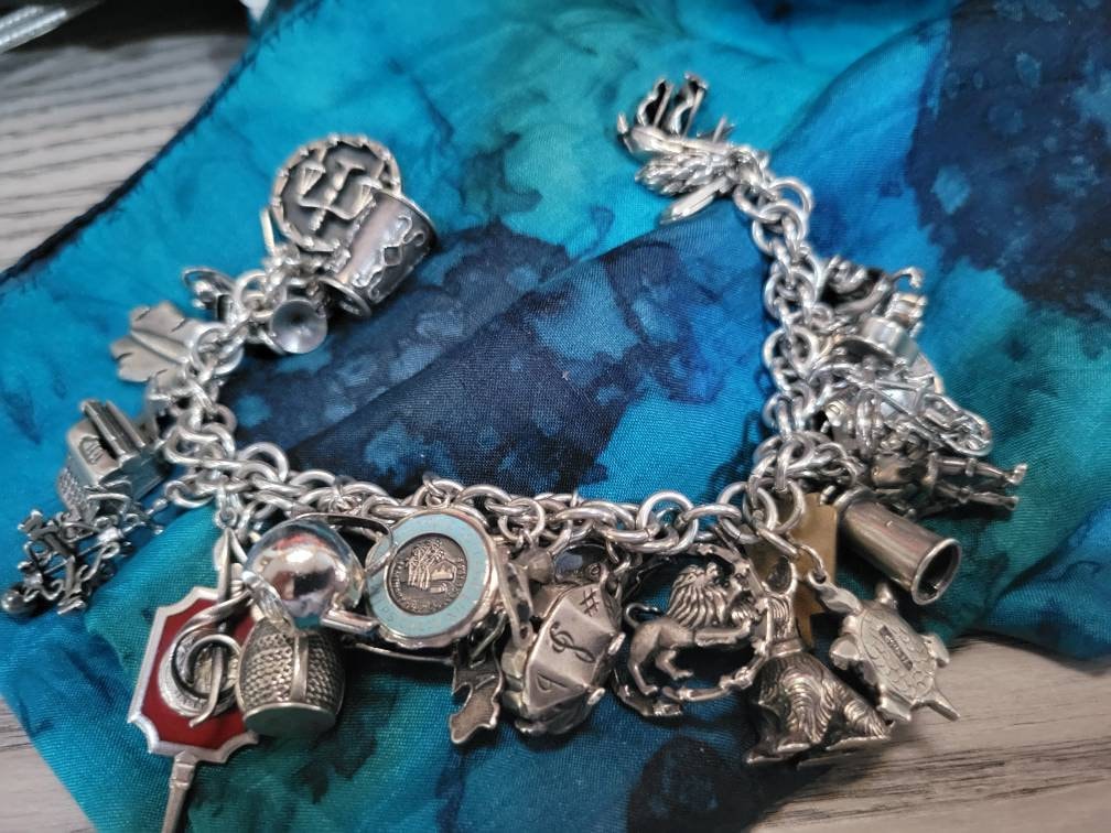 Vintage 1960s Sterling Silver Charm Bracelet With 29 Charms. Free Shipping - Etsy Vintage 1960s Sterling Silver Charm Bracelet With 29 Charms. Free Shipping - Etsy
