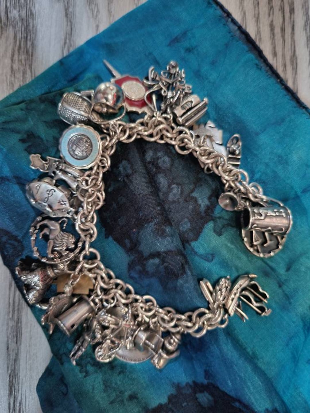 Vintage 1960s Sterling Silver Charm Bracelet With 29 Charms Vintage 1960s Sterling Silver Charm Bracelet With 29 Charms