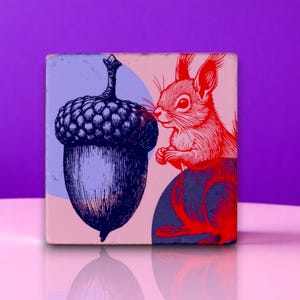 May include: Square tile with a red squirrel and a blue acorn illustration on a pink and blue background. The squirrel is detailed with red lines, and the acorn is shaded in blue. The tile has a glossy finish and is set against a purple backdrop.