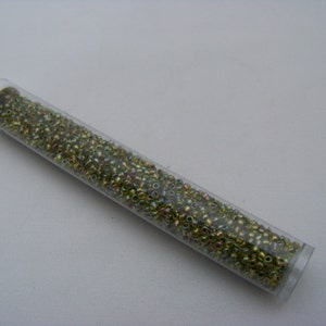 Toho 11/0 Gold-Lined Rainbow Peridot   996/282/275