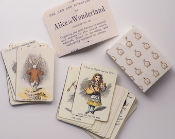 May include: A vintage game of Alice in Wonderland featuring illustrations of characters and scenes from the book. The game includes a deck of cards with images of Alice, the White Rabbit, the Mad Hatter, and other characters. The box is decorated with a pattern of pocket watches.